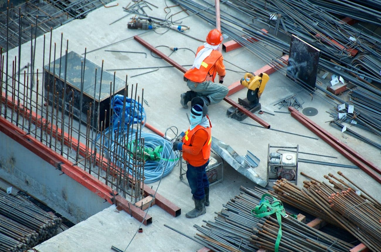 Crew in hi-vis and hard hats working on a deck